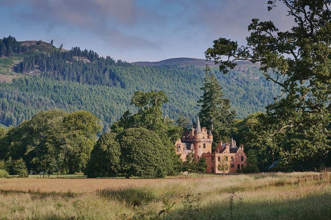 Aldourie Castle, Inverness, exterior with surrounding woodlands and bothy stays