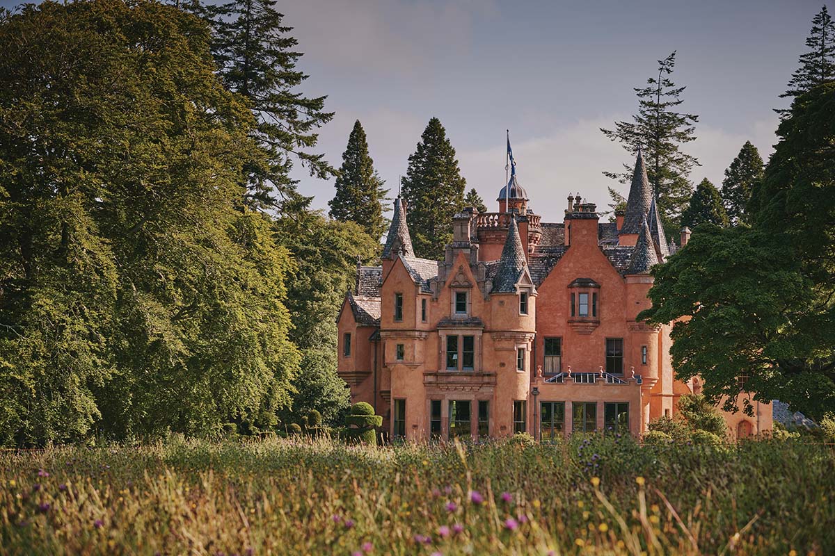 Aldourie Castle, Inverness, exterior with surrounding woodlands and bothy stays