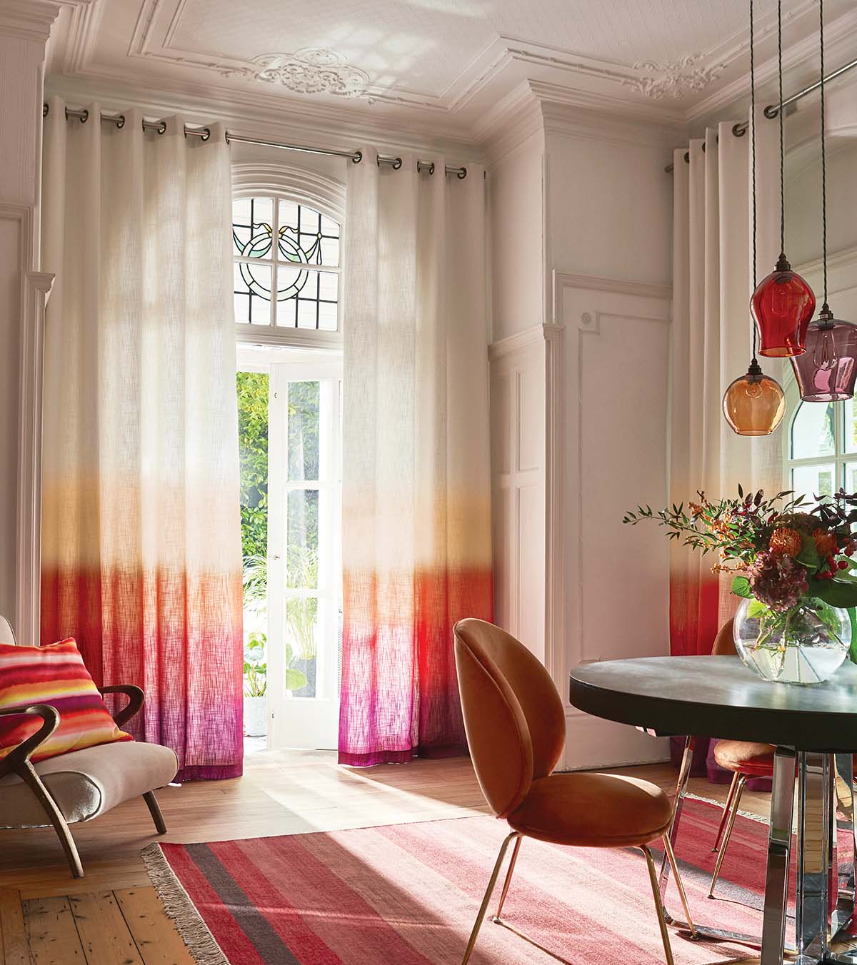 floor to ceiling curtains in bright red living room for summer