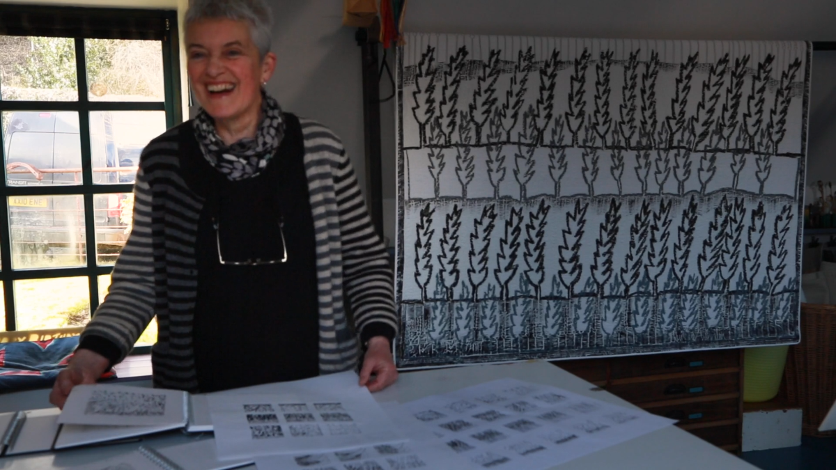 artist making textile art and wuilt in scotland in dark studio 