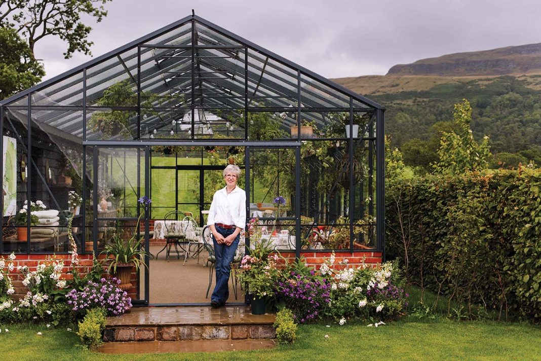 katy rodger at knockraich farm in front of a glasshouse