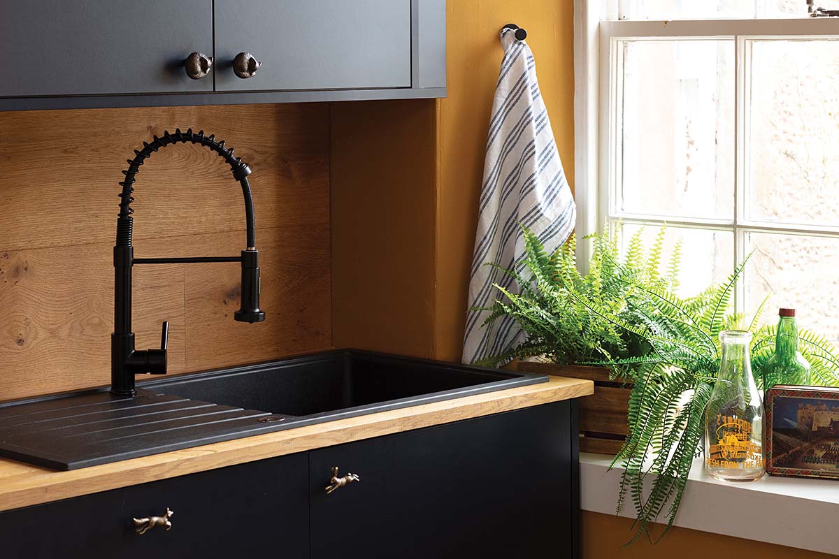 kitchen sink in black with light white windowpanes in hillockbrae farm in perthshire