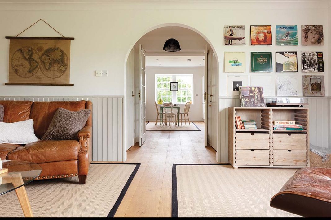 susie lowe photography captures dark leather sofa and cream colour scheme on perthshire home