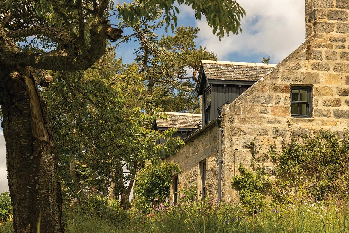 MOXON ARCHITECTS ABERDEENSHIRE COTTAGE STONE OLD MONEY HOME IN FOREST SURROUNDED BY TREES