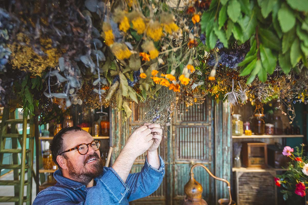 banjo beale in designing the hebrides hanging dried flowers in an apothecary on Harris