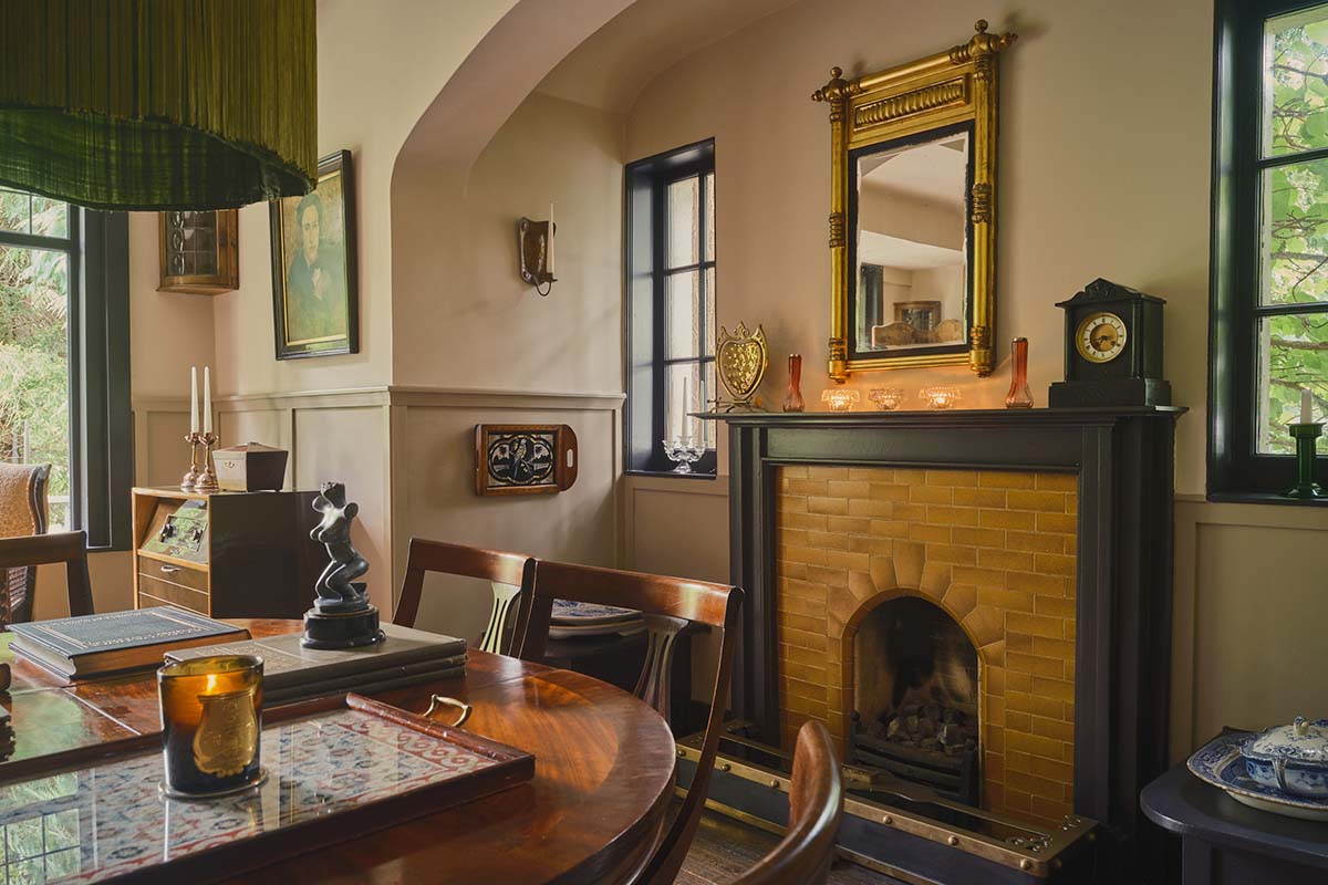 arts and crafts movement home with tiled fireplace in grand dining room