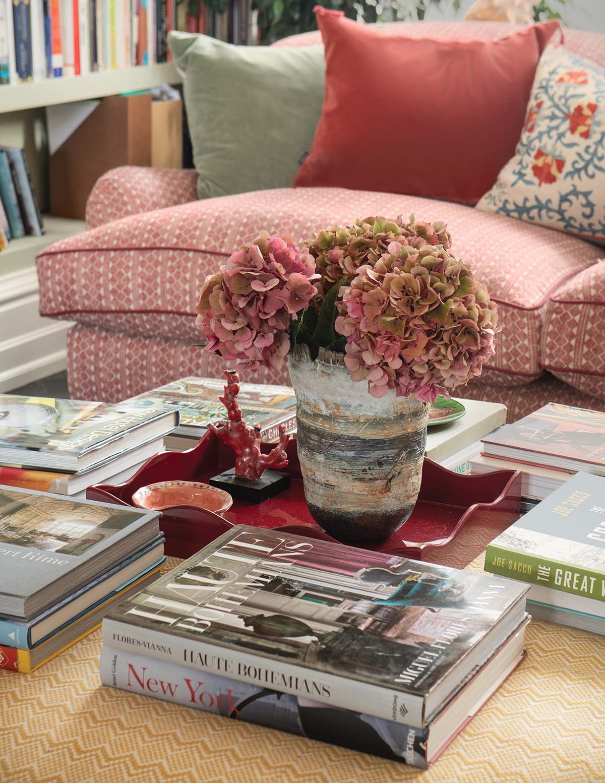 coffee table with books in cottage-core style, old money influence and decoration of old family house