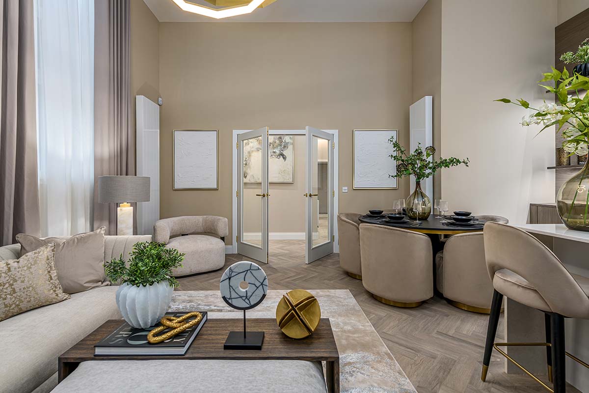 Living room view of the open-plan living and dining are of the show apartment at Kelvin Properties The Old School House development in Glasgow, interior design by Fotheringham Interiors