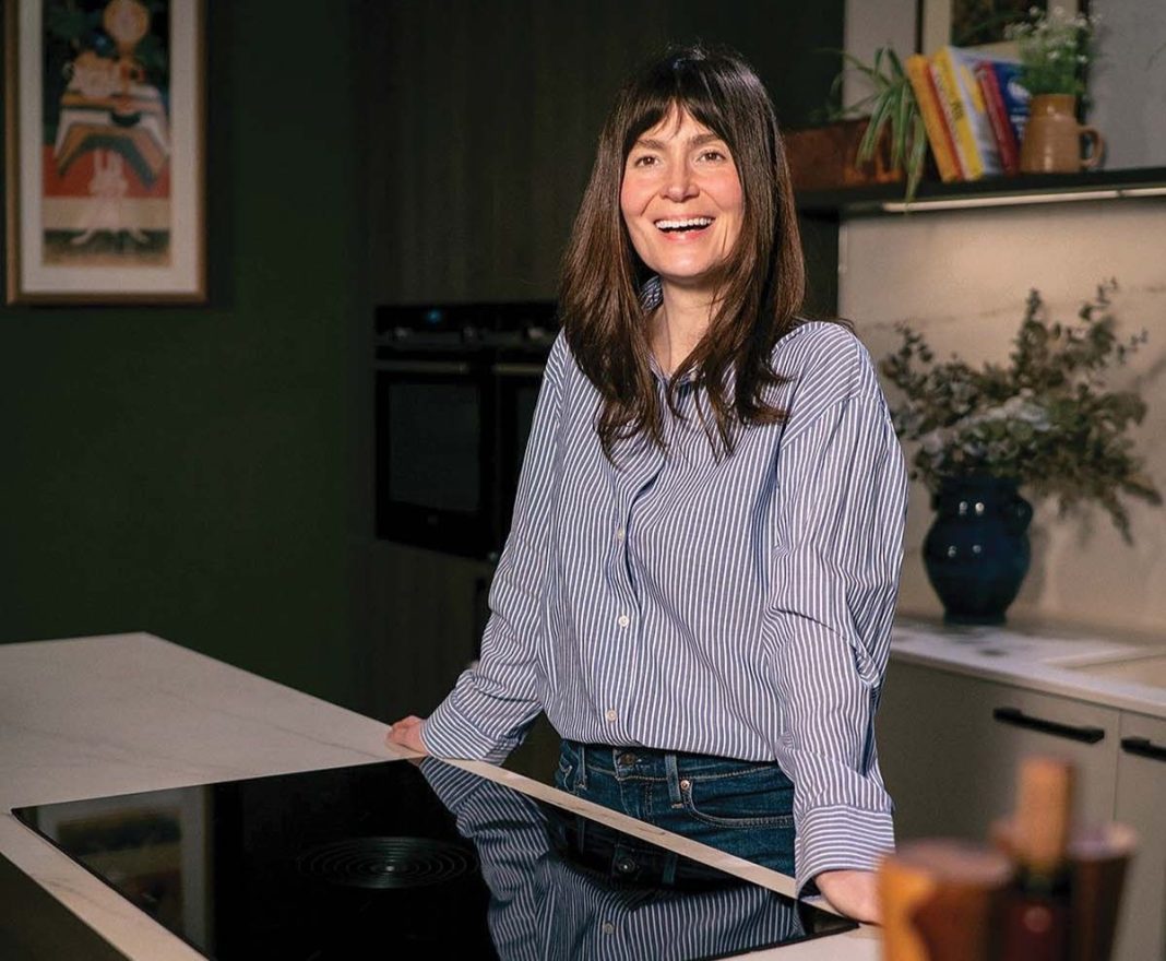 Natasha Raskin Sharp in the kitchen of her Victorian tenement flat in Glasgow