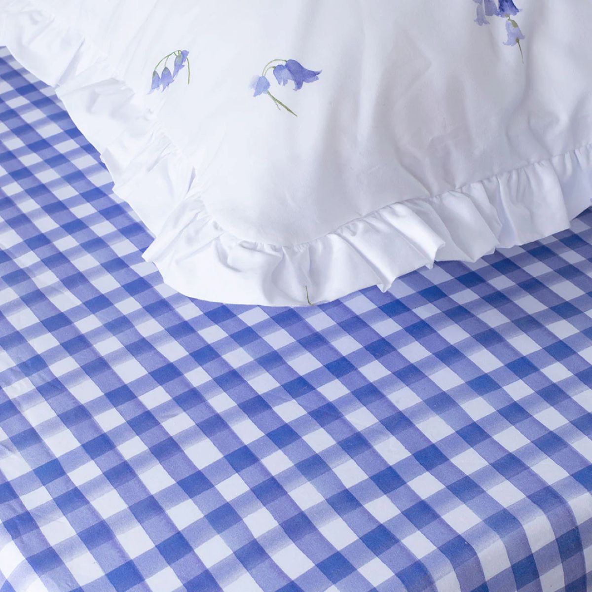 a simple design idea is to add a Bluebell Gray fitted gingham sheet to your bed