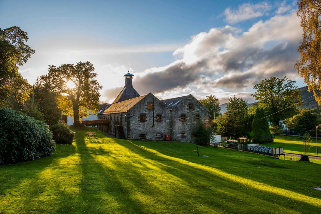Dewar's Aberfeldy Distillery in the heart of the Scottish lowland countryside on a sunny day