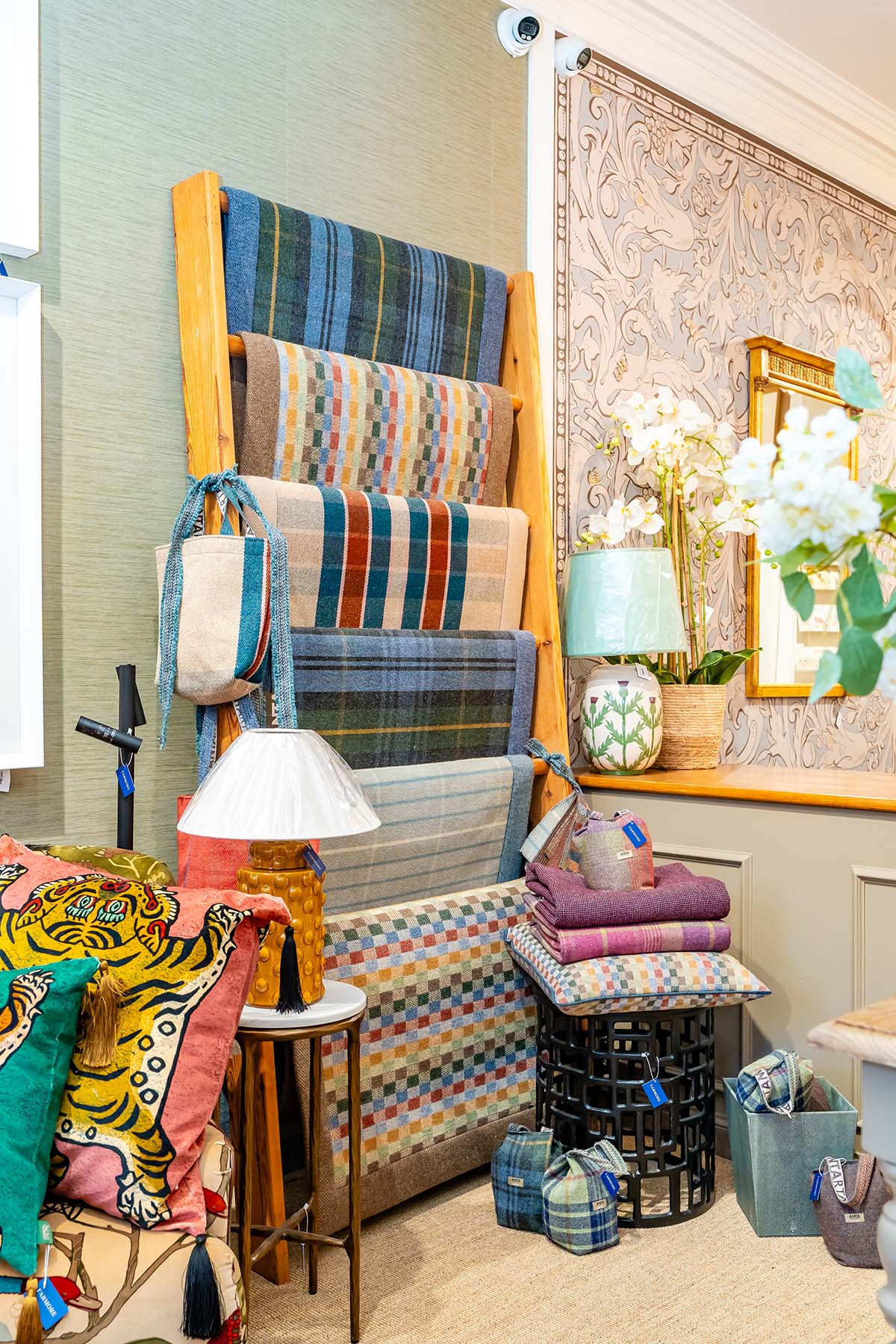 Farmore interiors shop in st andrews stocking eclectic glabally-sourced homeware including card, ceramics, skincare, furniture, art and baby toys - anta throws in tartan