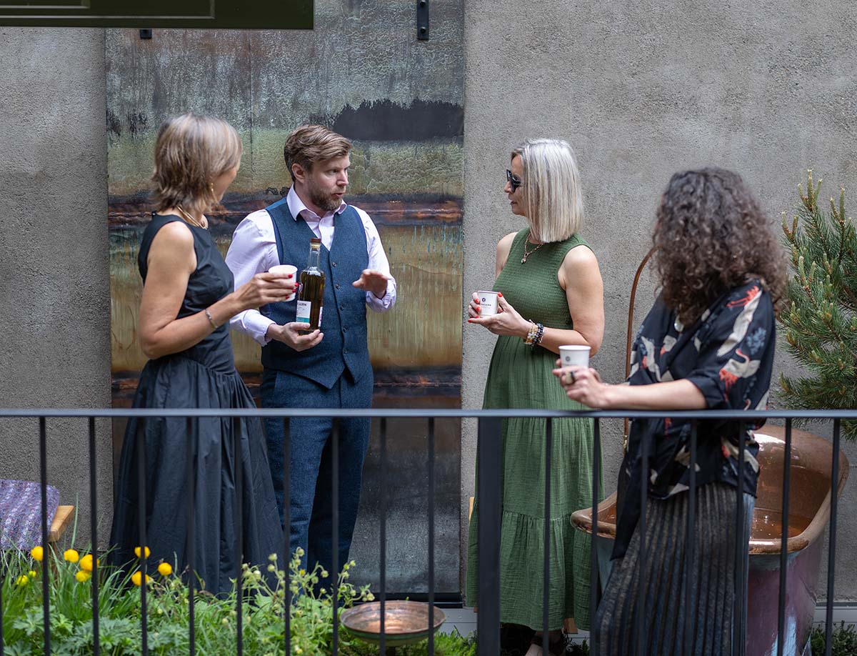 Andy Lennie of Fettercairn Distillery stands with Garden Designers Helier Bowling, Sally Giles and Sonia Kamel at The Fettercairn Wilderness Retreat balcony garden at the RHS Chelsea Flower Show in London. The garden is inspired by the Scottish Cairngorms landscape, home of Fettercairn’s 200-year-old distillery