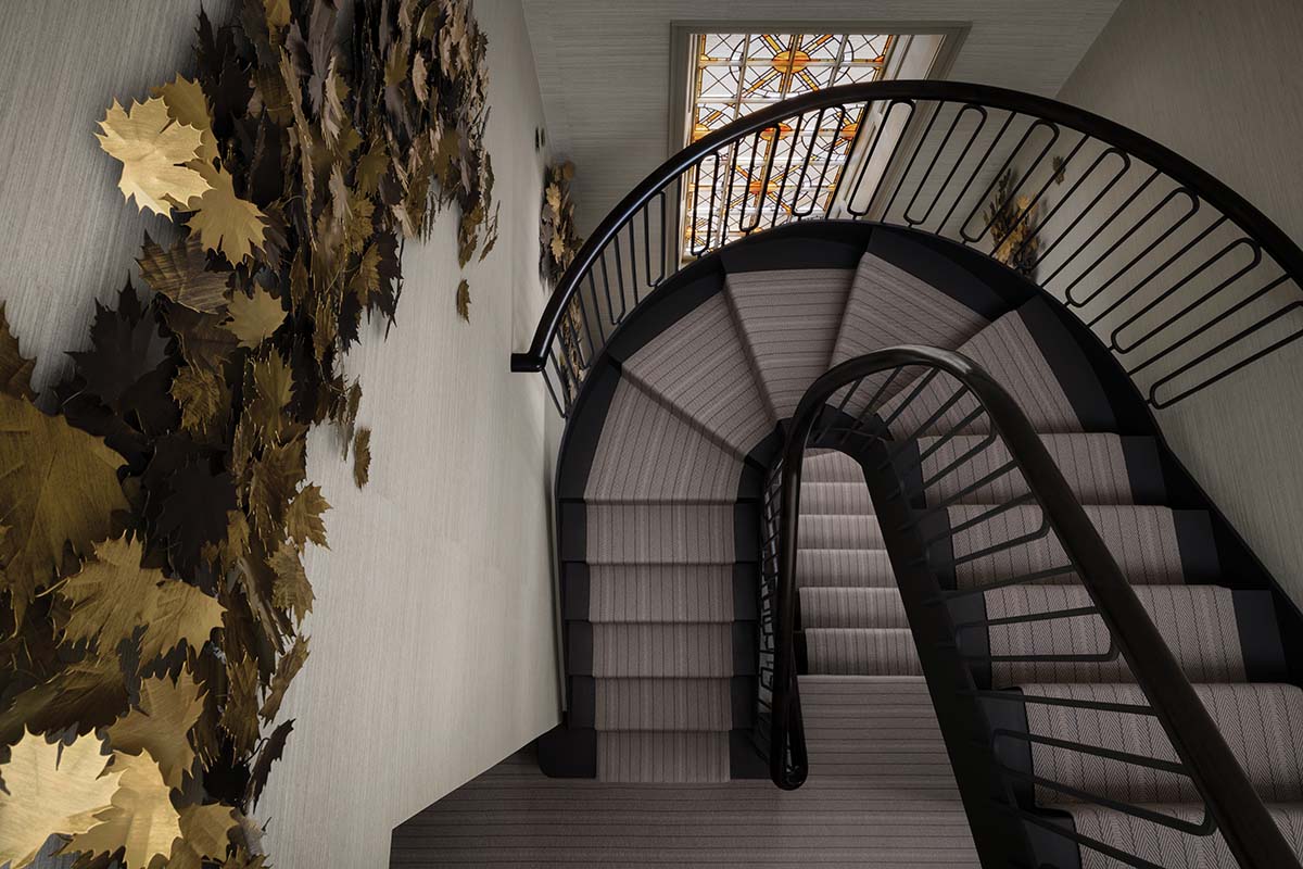 incredible winding staircase with gold leaf sculpture mounted on the wall in a revamped Edinburgh house