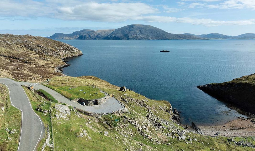 This coastal Harris home boasts panoramic views of the hebridean sea in Scotland - right from the bathroom