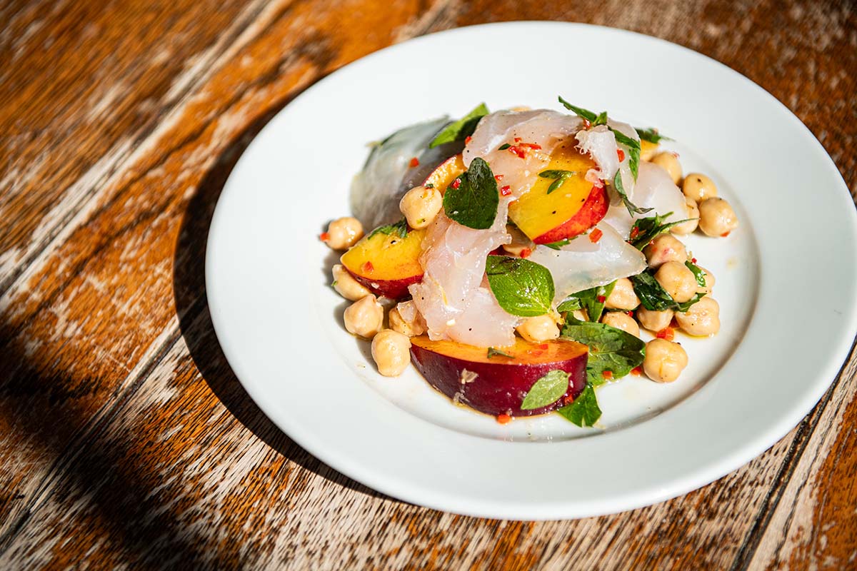 Salt hake and peaches with chickpeas, oregano and chilli from The Palmerston in Edinburgh