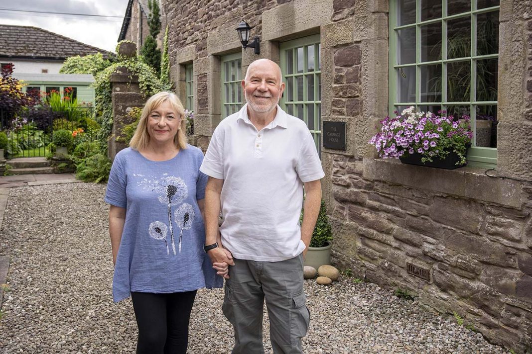 scotlands home of the year 2025 episode four contestants at the carriage house in auchterarder, a victorian conversion in scotland - a cottage with green windowpanes and a gravel footpath