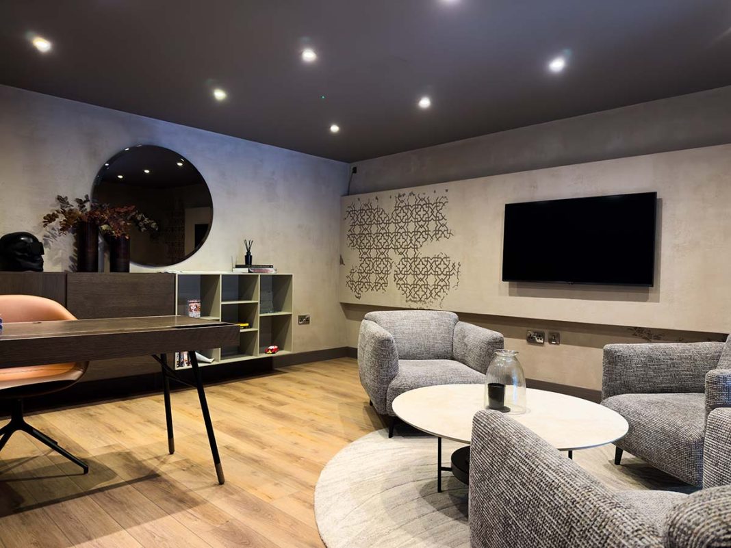 an open office space with venetian plaster walls and furniture from BoConcept
