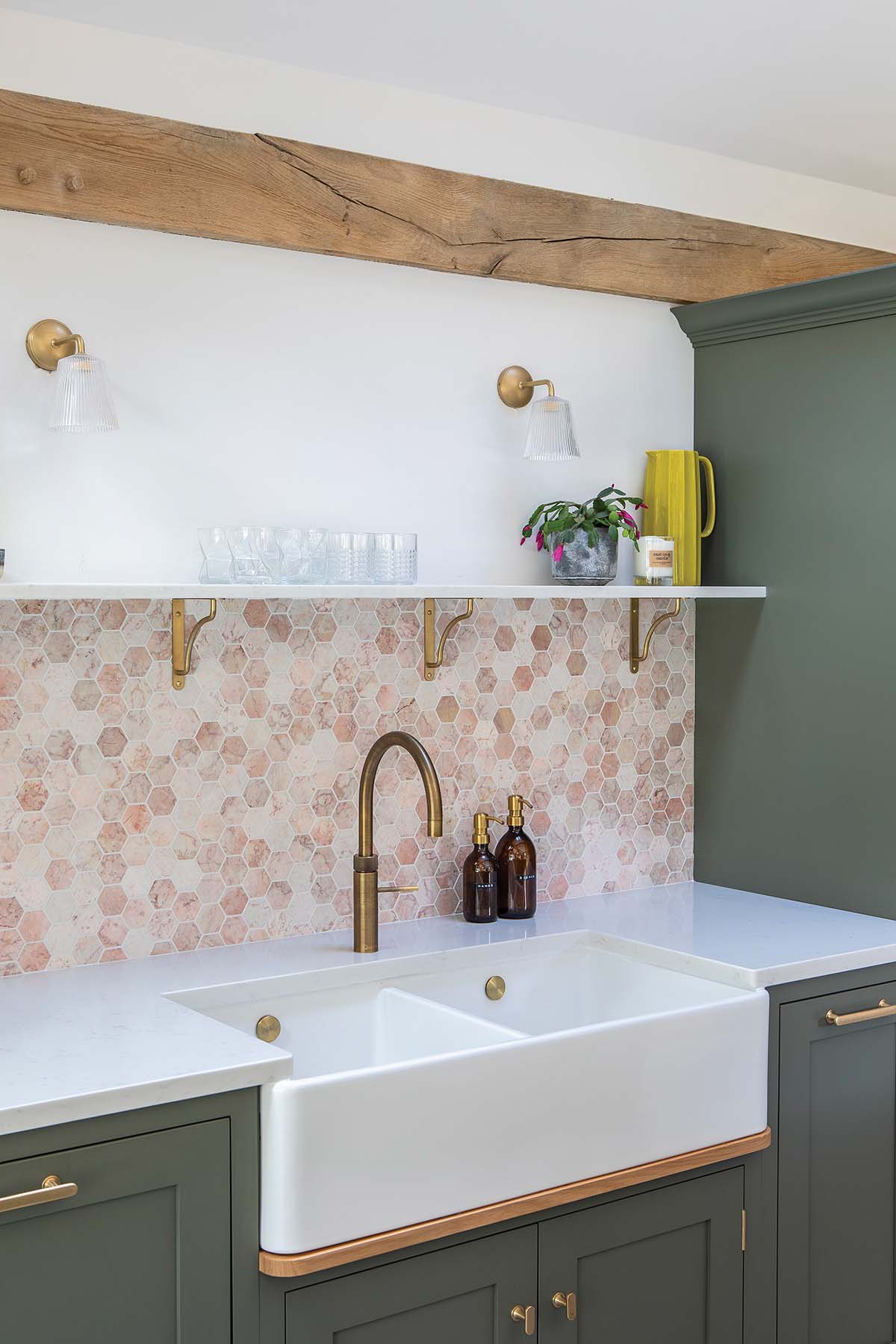 Shaker inspired kitchen designed by Louise Parr for The Painted Kitchen in Cupar, Fife with pink splashback over inset ceramic white sink