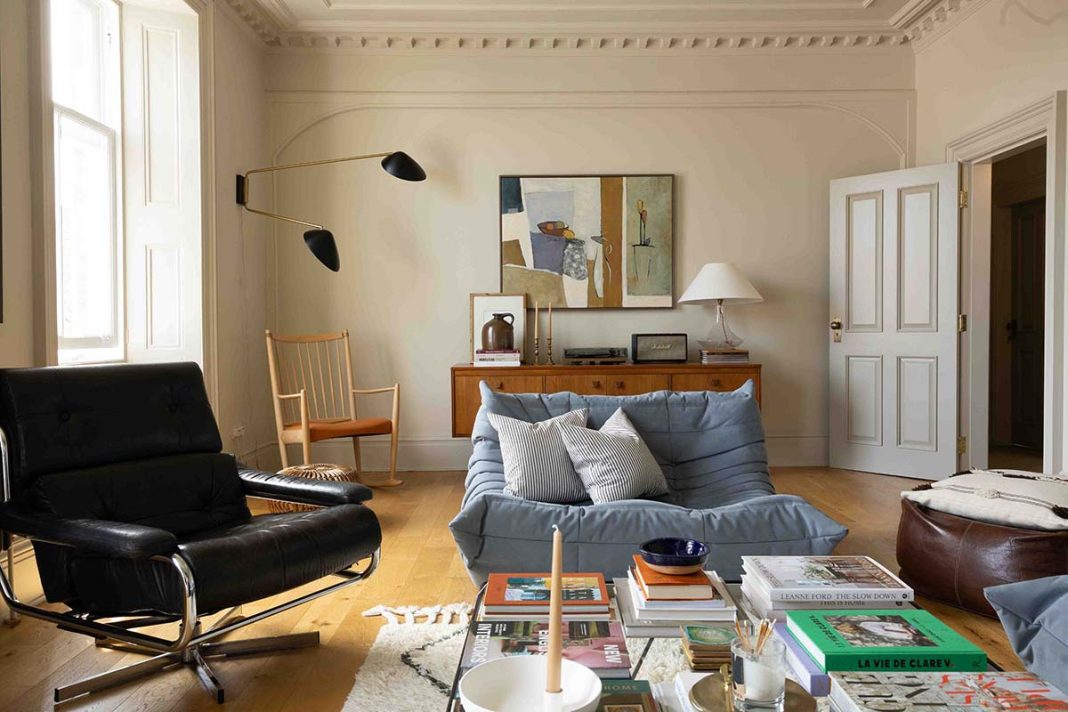 In the evenings, when the guests are out to dinner or have settled in their rooms, Laura and Paul relax in their private living room, which syncs with the style of the rest of the home. The powder-blue Ligne Roset Togo was a recent investment.