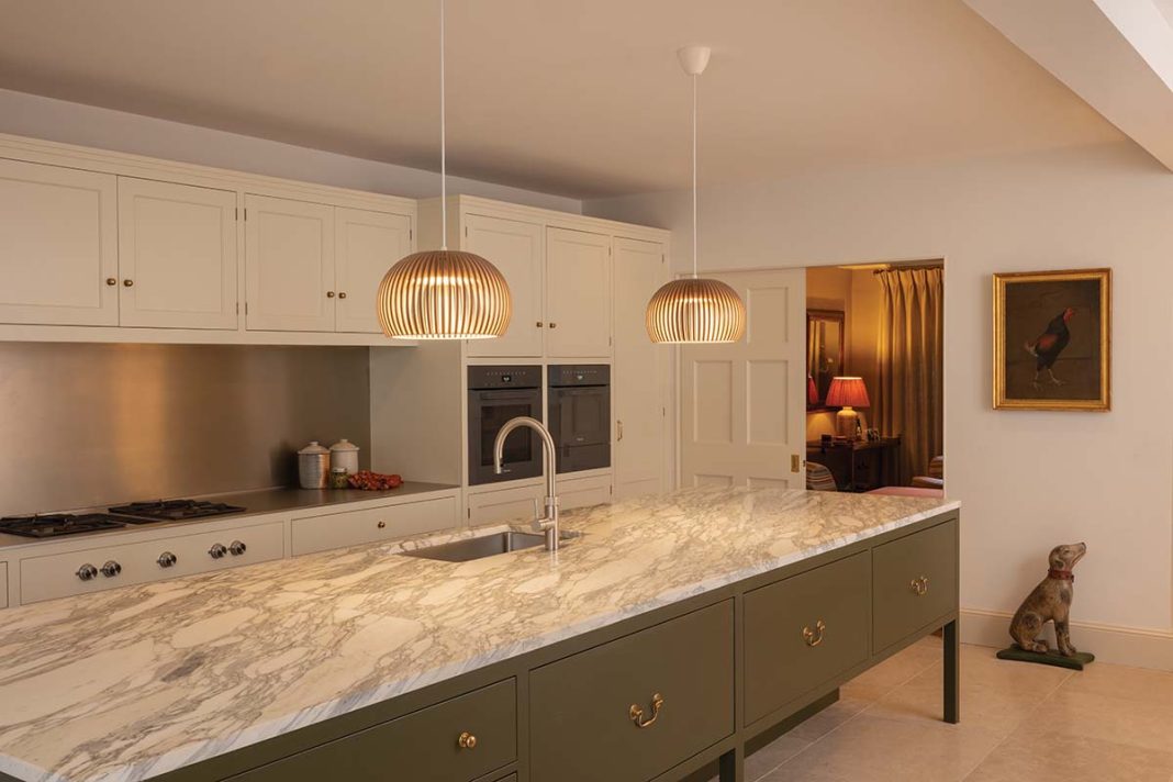 A classic below-stairs kitchen that feels timeless while incorporating all the requirements for modern living