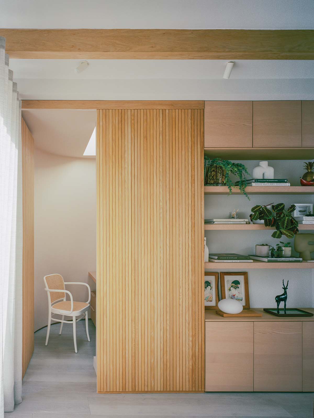 wood paneling in a living room with wooden overhead beams in a two-storey home in edinburgh