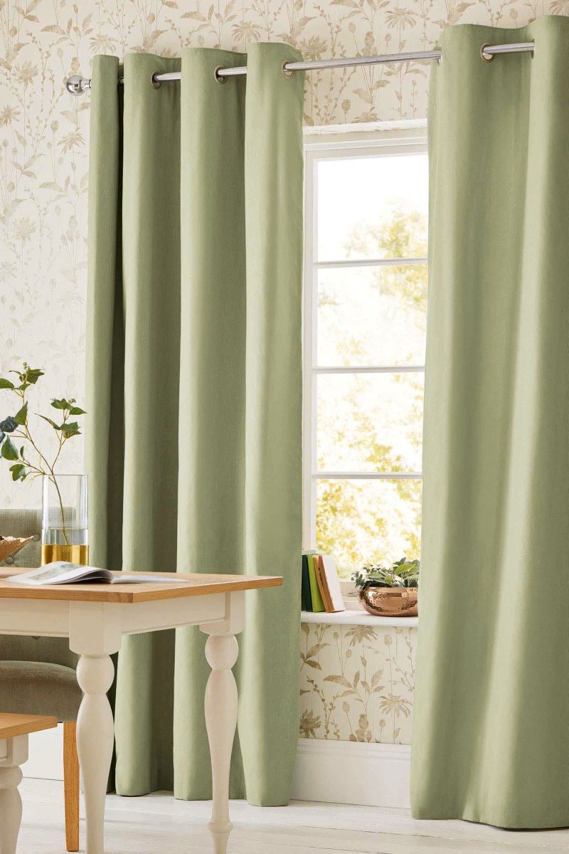 Use heavy curtains to retain heat in your home this winter - how to heat your home on a budget