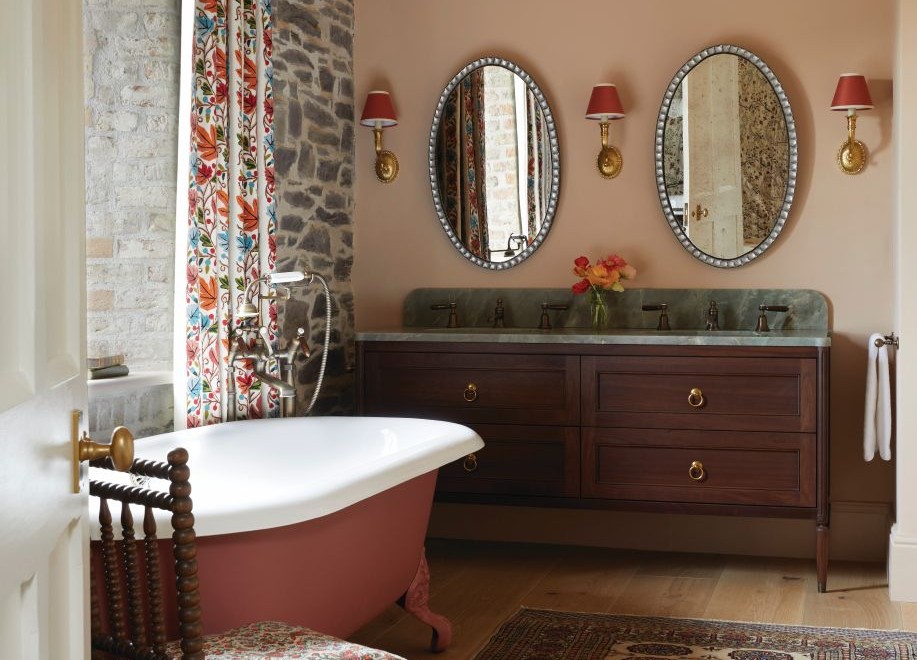 A historic home calls for a traditional bathroom, but there’s nothing stuffy about this witty blend of rich fabrics and antique finds