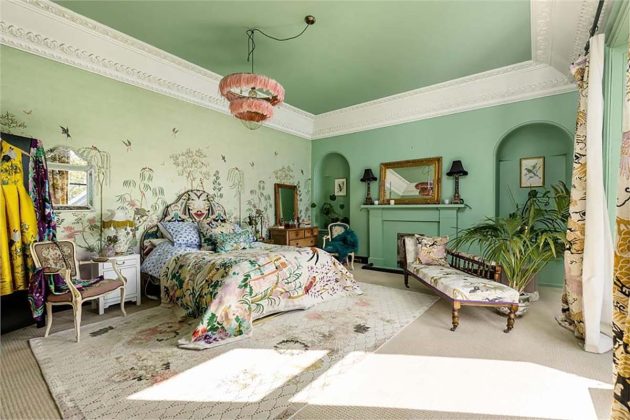 pastel green bedroom with floral bedspreads and floral curtains