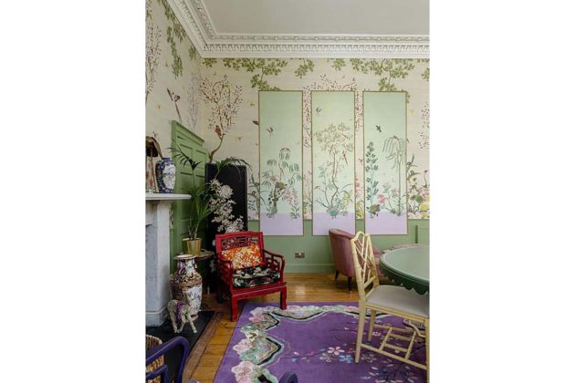 living room with mural walls, pastel green windowpanes, a large purple wendy morisson rug