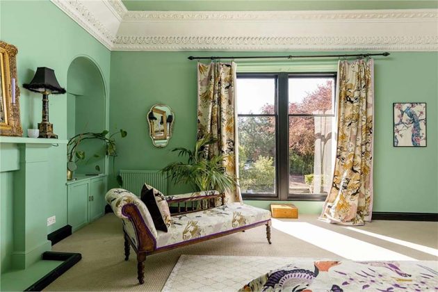 pastel green living room with floral chaise lounge and floral curtains