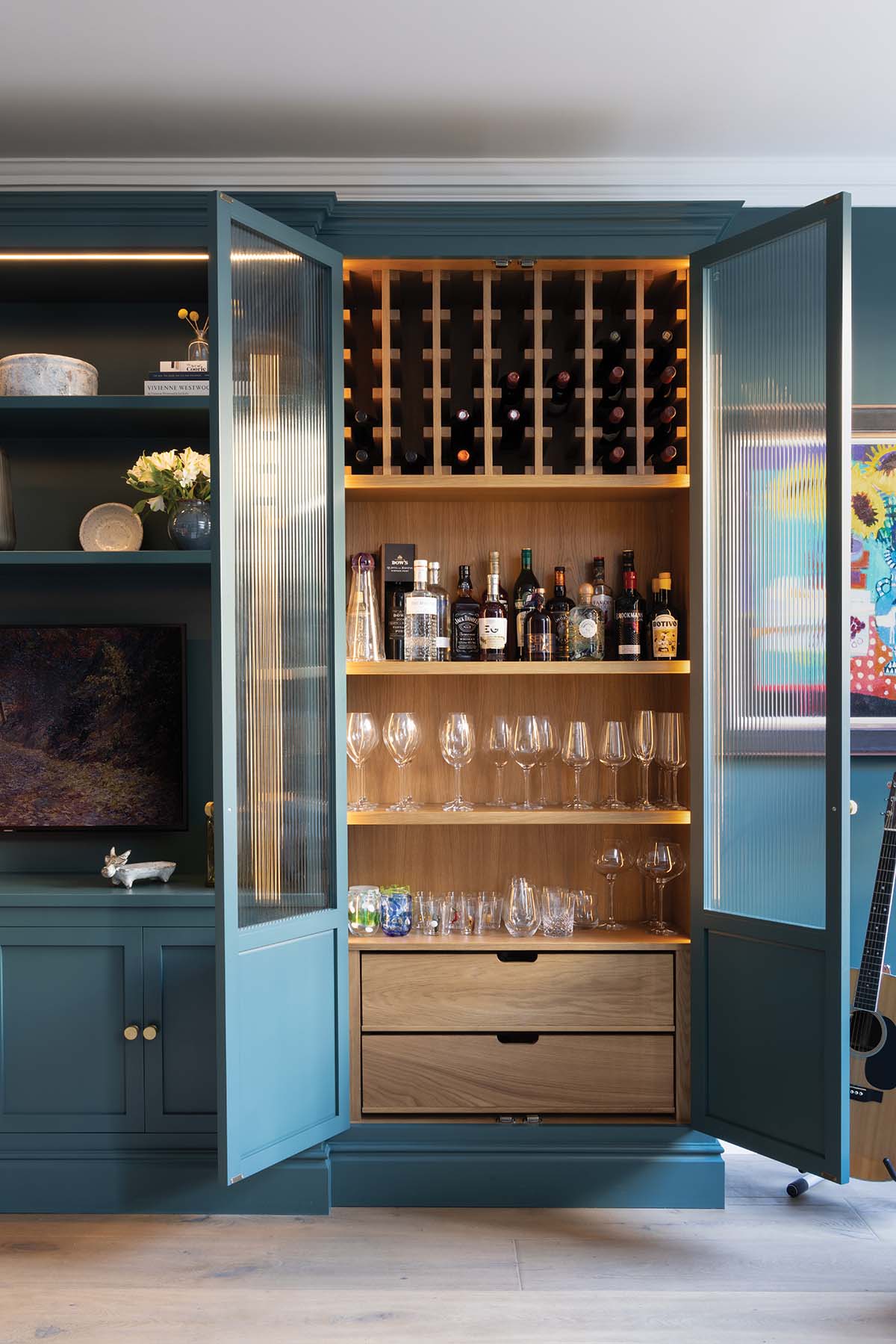 peden and pringle blue and orange kitchen with hidden storage