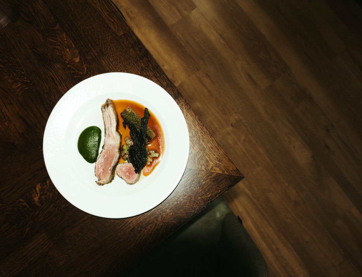 Lamb saddle comes next, paired with a yin and yang of Tuscan cavolo nero, crispy lamb breast and green peppercorn at Brett