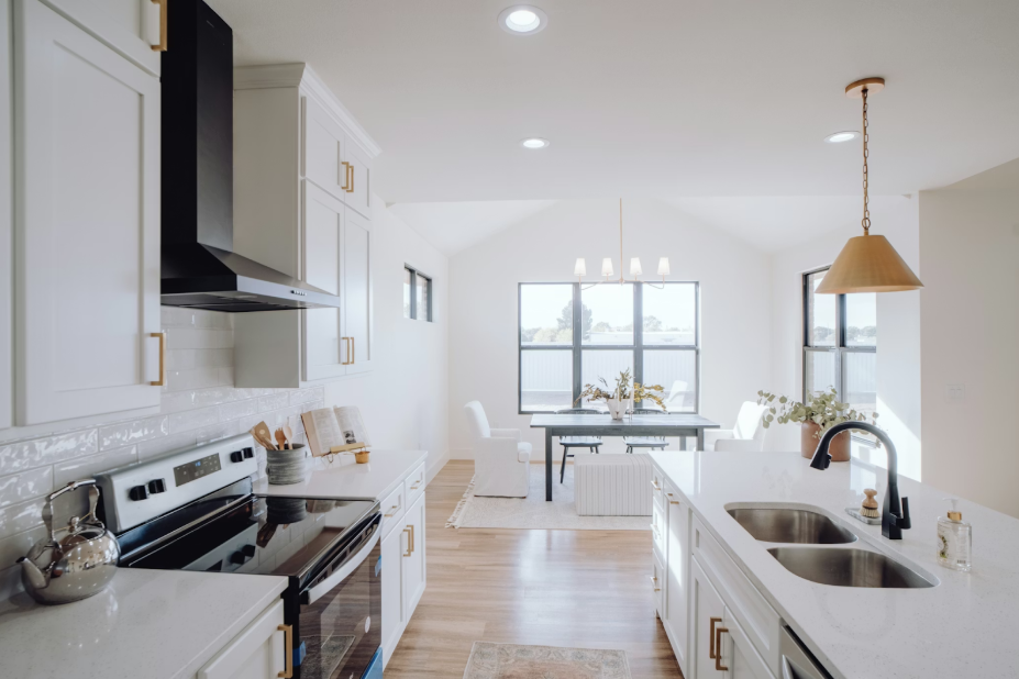 bright white open plan kitchen and dining area in a contemporary modern home