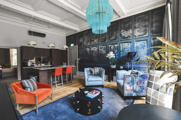 colourful living room with blue shimmery walls and patterned sofas