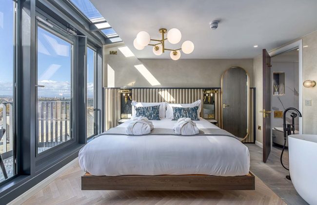 pastel blue bedroom in high-end luxury hotel