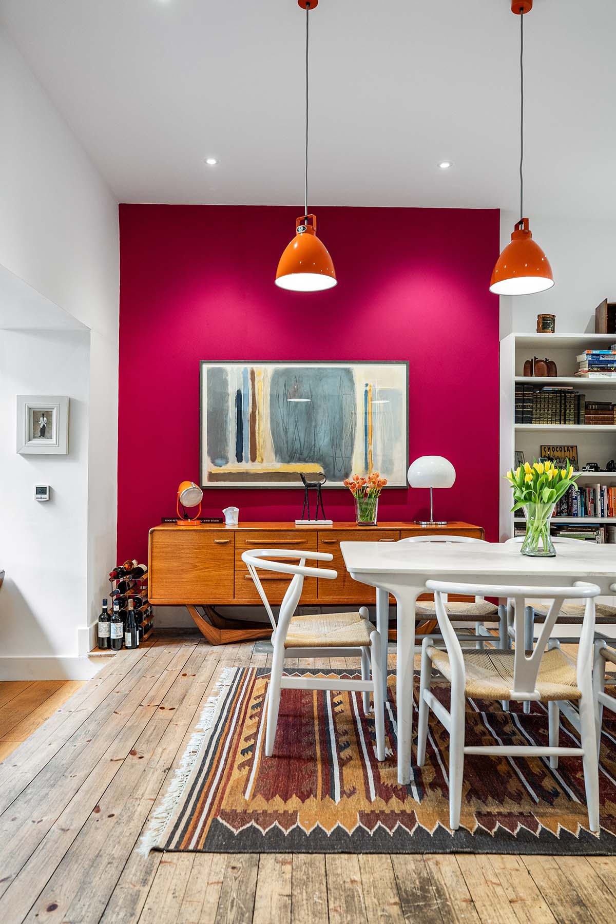 pink kitchen with orange pendant lighting in a house for sale in scotland by Corum