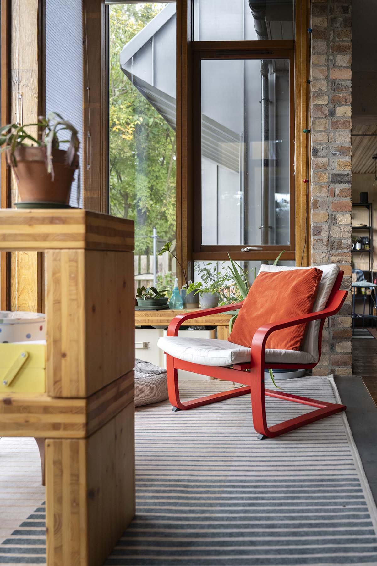 scotland's home of the year 2026 winners interview with opinions from anna campbell jones, danny campbell and banjo beale; red hallway and entryway with exposed stone walls and a handcrafted winding oak staircase