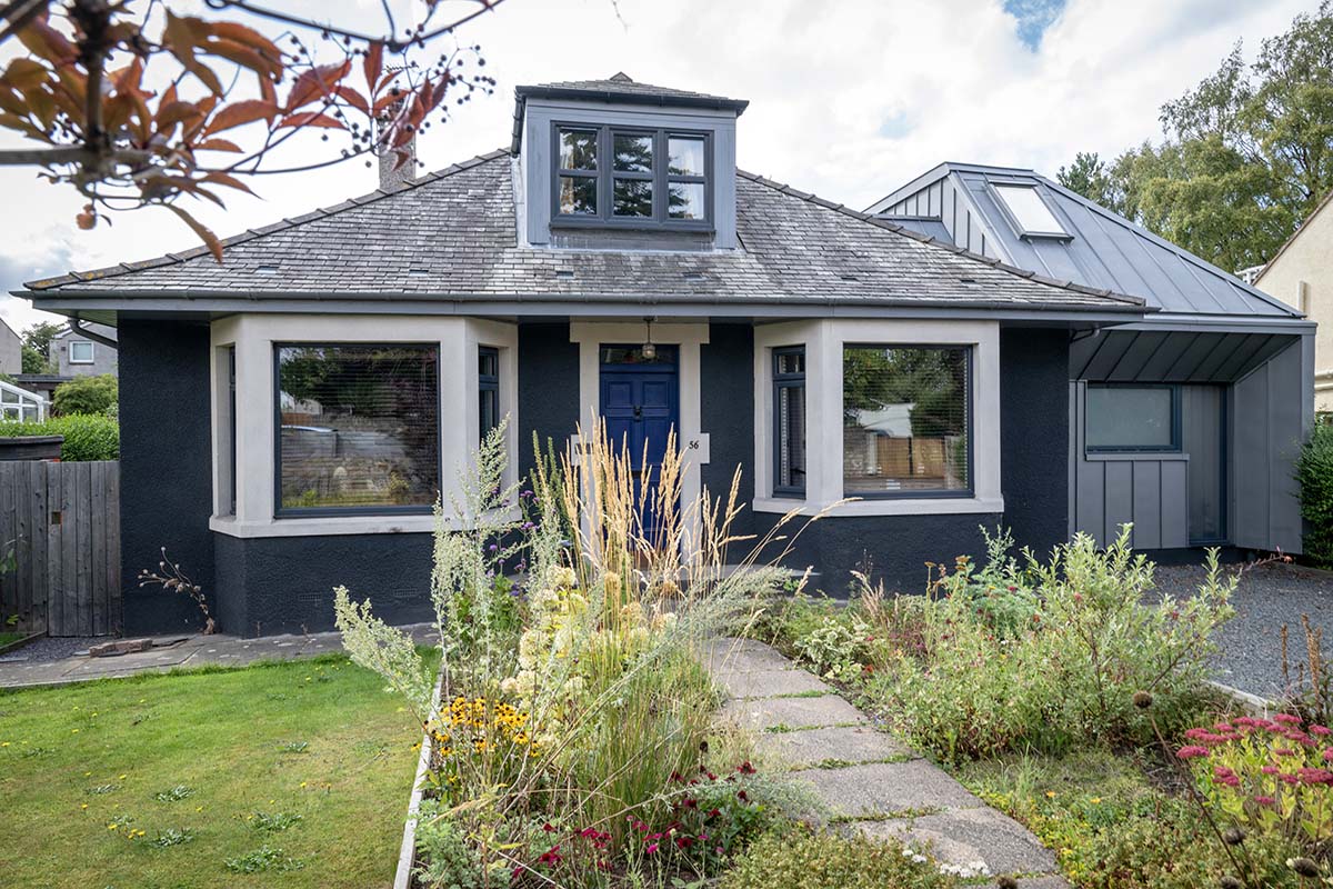 a blue cottage in scotland decorated in mid-century style using sustainable timber and eco-friendly fixtures SHOTY