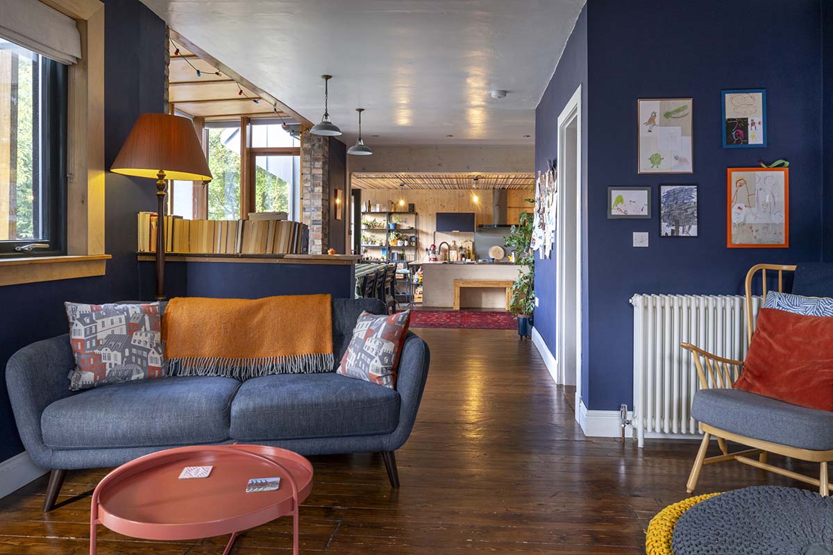 SHOTY winners interview with opinions from anna campbell jones, danny campbell and banjo beale; blue living room with rust orange cushions and white ceiling and colour drenched walls