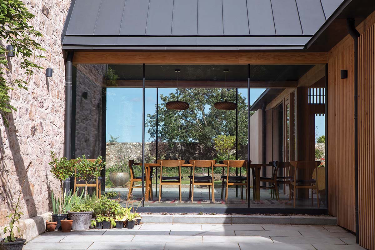 glass fronted dining room in a 200-year-old douglas fir extension