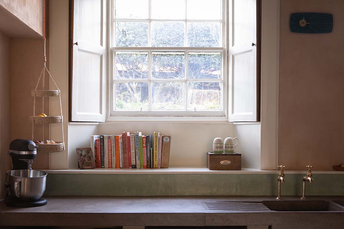 nicholas denney studio designs the concrete surfaces in this rural pink kitchen