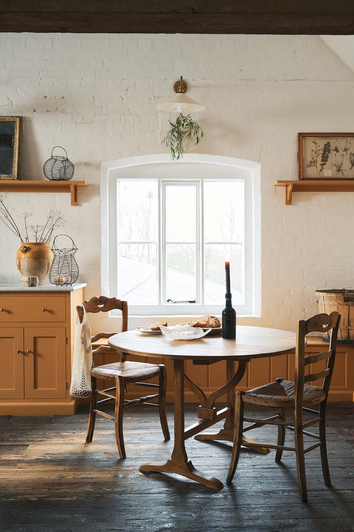 shaker ktichen inspired by french bistros; orange cabinets and hardwood floors