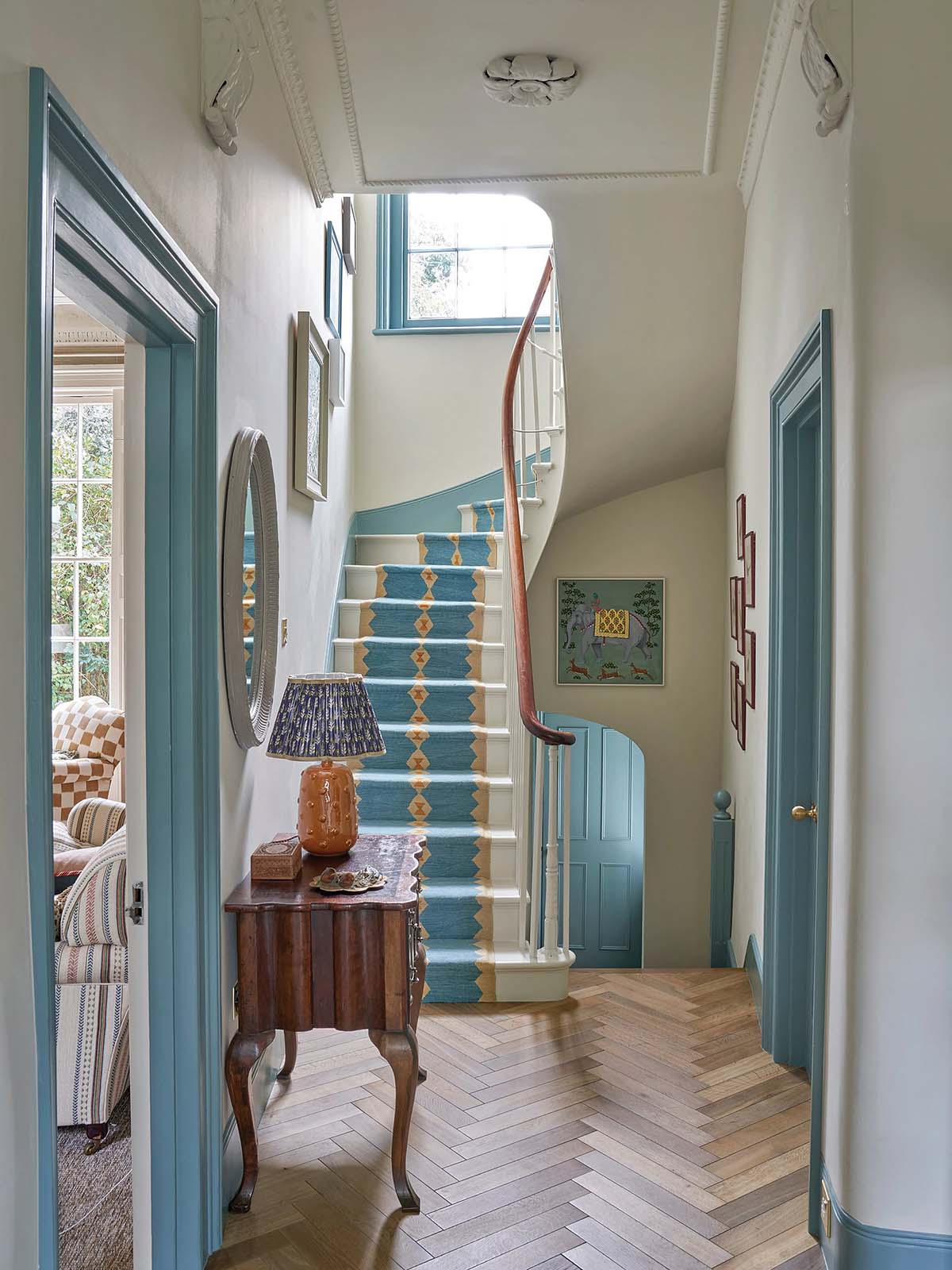 blue and cream hallway in a victorian home by sims hilditch