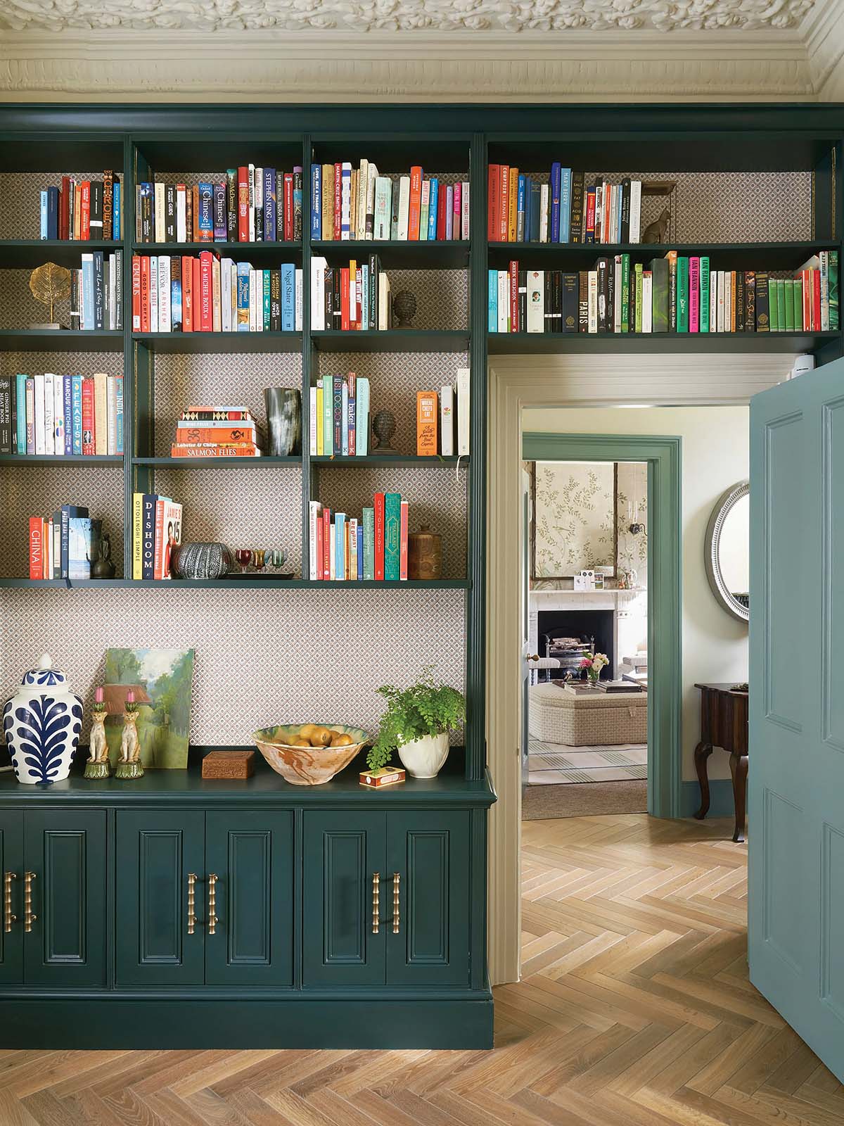 bookcase and library with blue doors and wooden floor