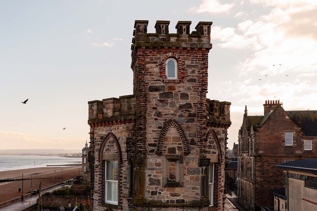 The exterior of centuries-old The Tower in Portobello, a luxury event space for private events, weddings, supper clubs, brand takeovers and more