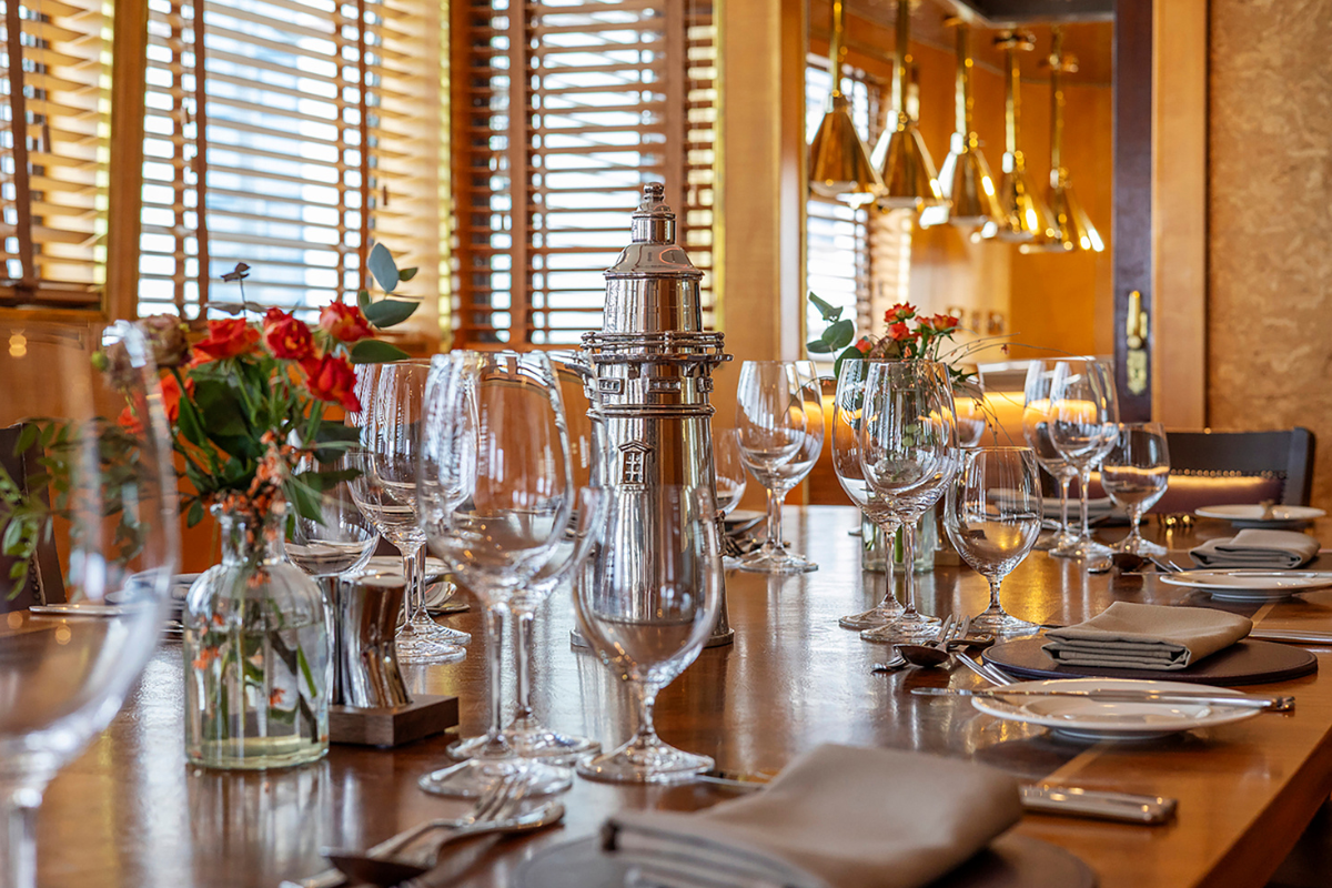 Fingal Hotel new kitchen by kitchens international, with golden lights above the pass and a mini chef's table for guests