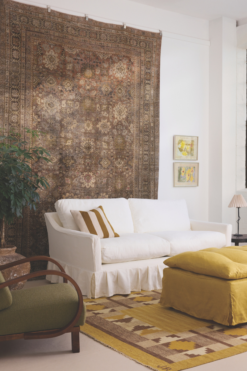 white Sonder and Stowe couch at home with brown artwork and persian rug