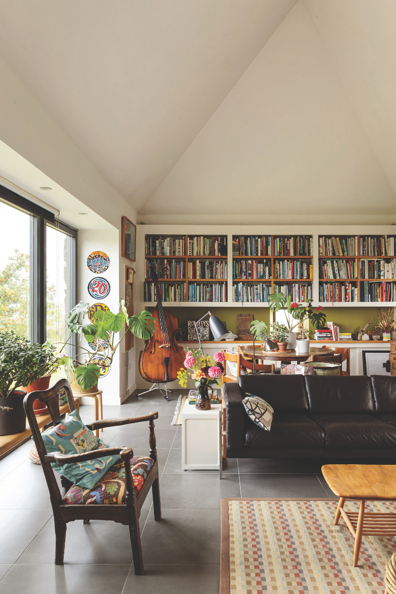 The steading brings the garden inside with plants and art adding colour