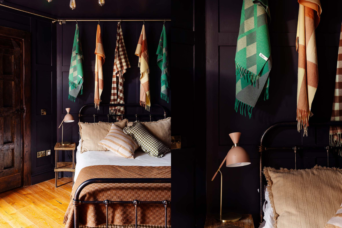 dark plum walls and tbco blankets in an old tower house in portobello